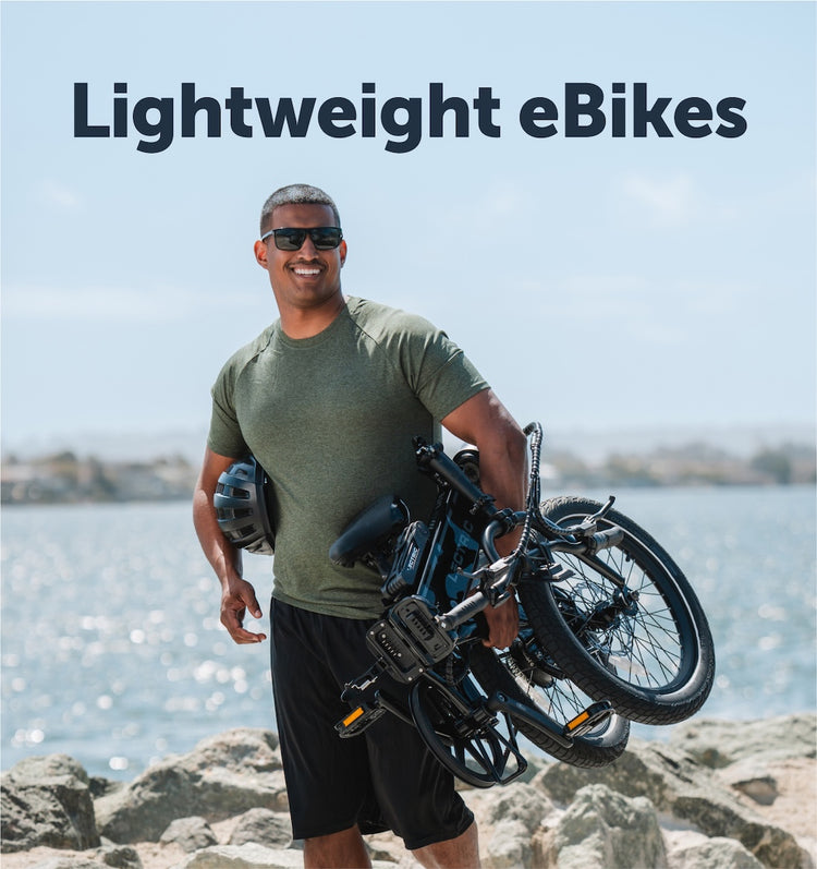 Man holding a lightweight, foldable Lectric lightweight eBike.